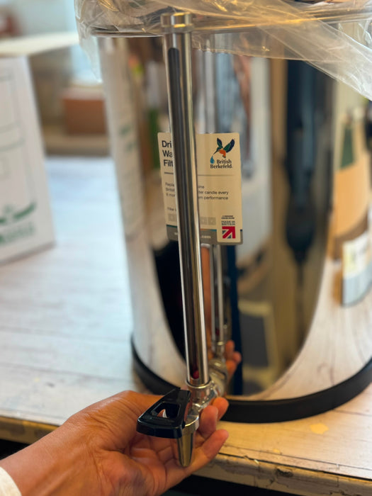 Faucet with push button on demand and water level gauge 